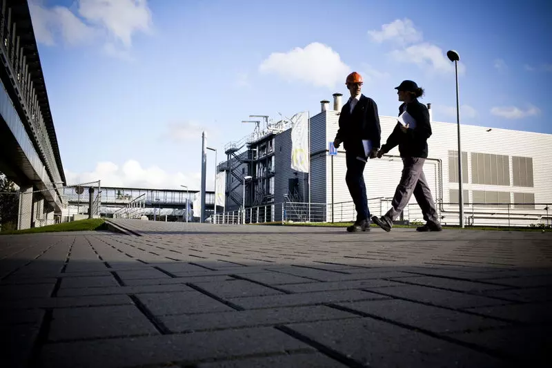 Man walking behind a building